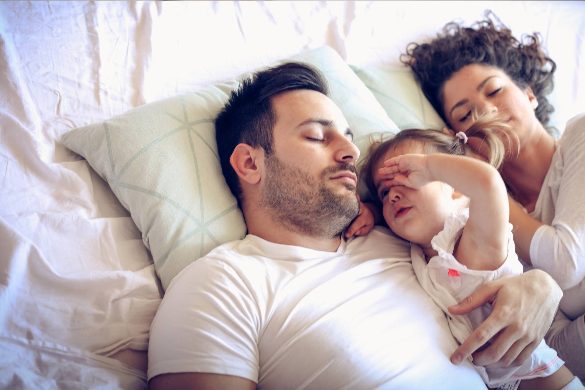 Family in bed together 