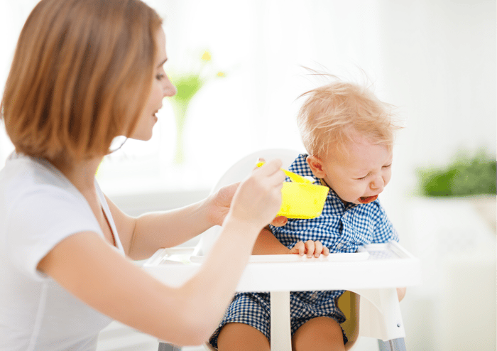 Mother feeding toddler who is a fussy eater