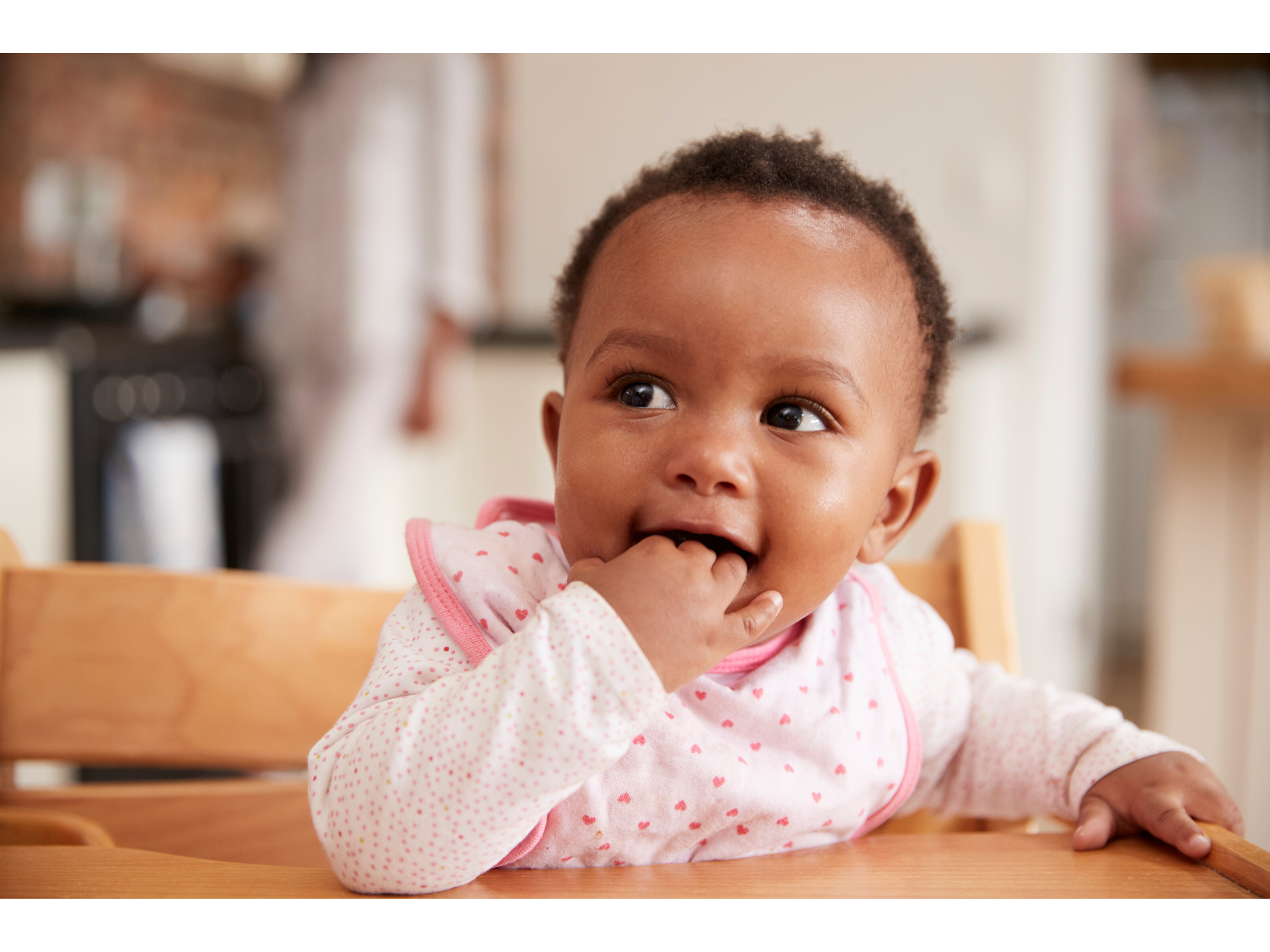 Hungry baby biting their fingers and waiting for food 