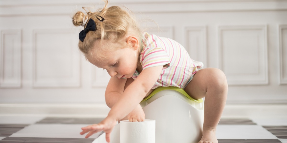 Child potty training and reaching for toilet roll