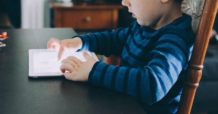 Child playing with ipad