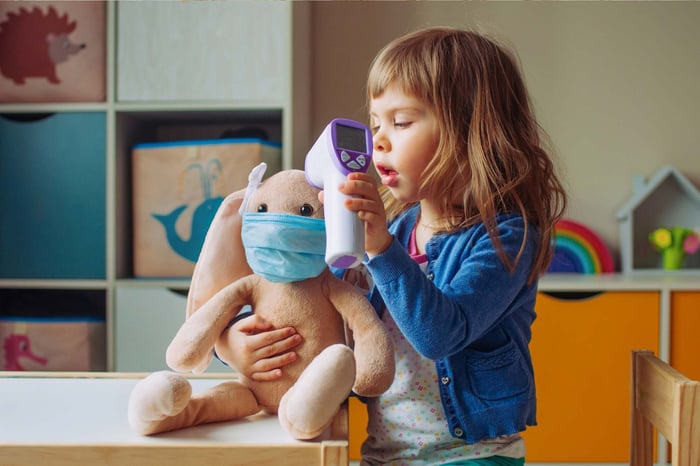 Little girl playing with her rabbit - imaginary play