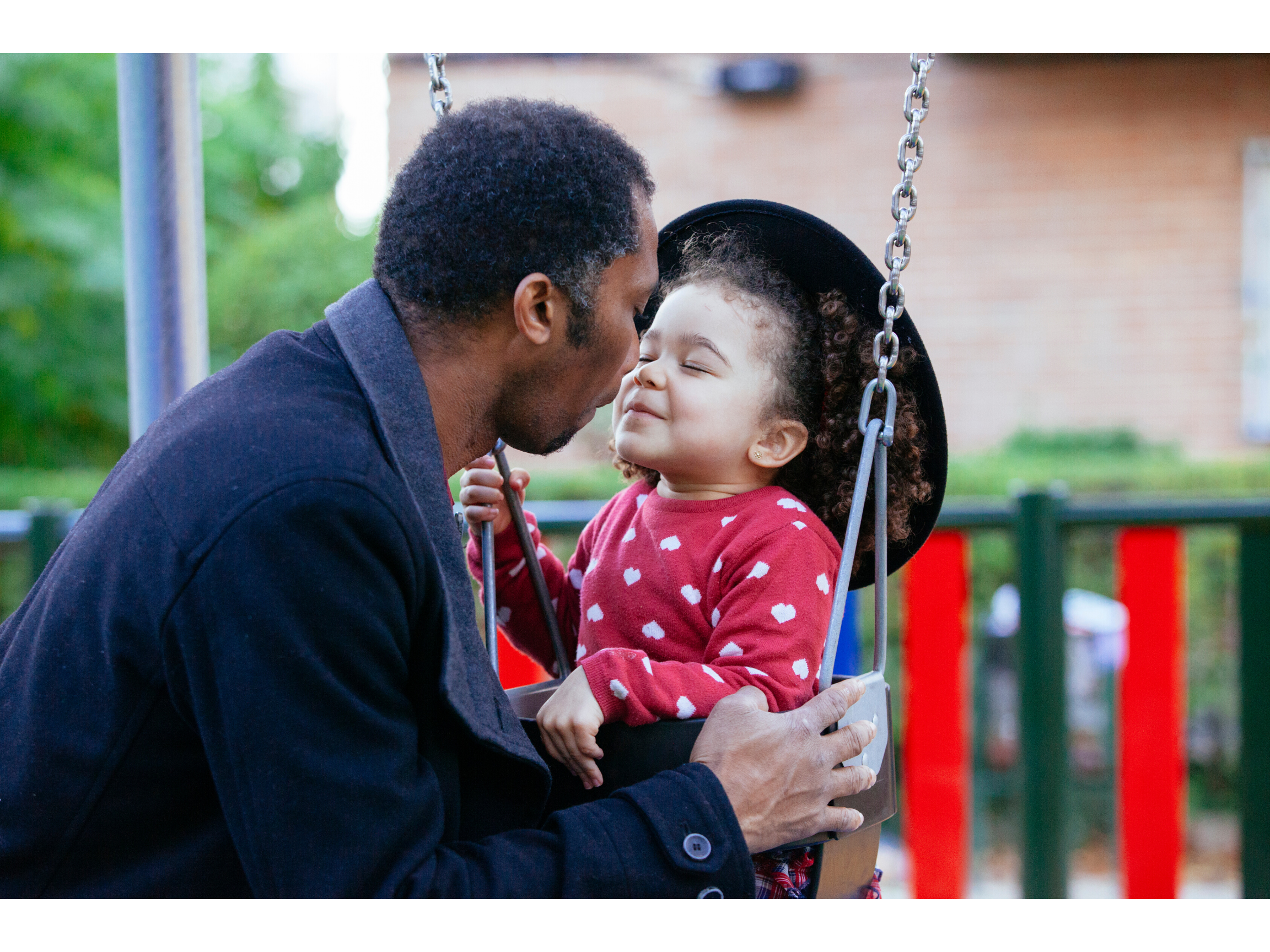 Father saying goodbye to his toddler at a nursery