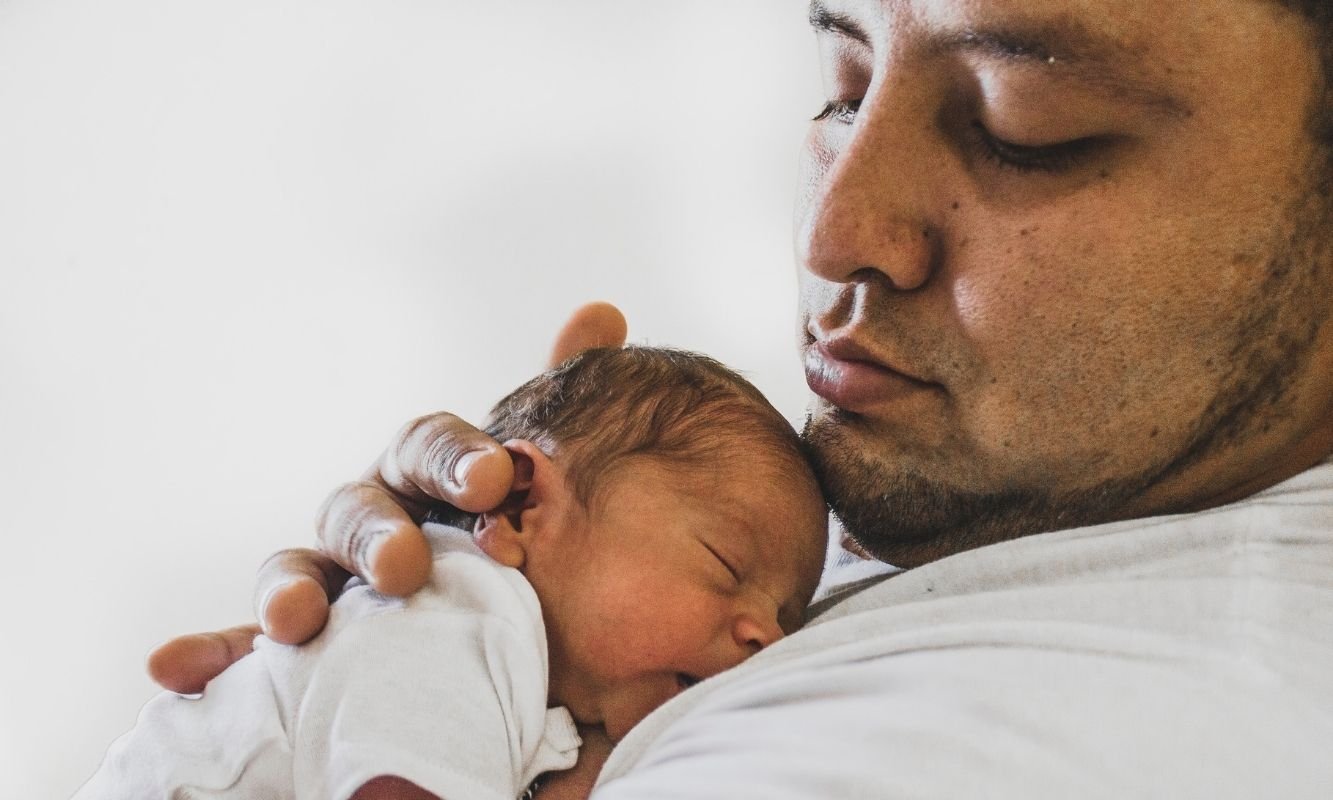 Dad holding his baby