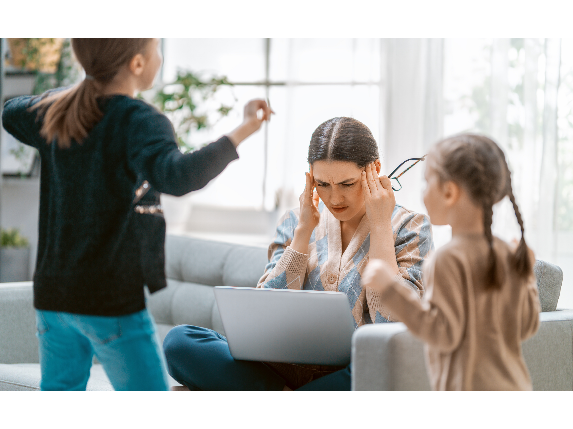 parent struggling to cope while working from home with two young children