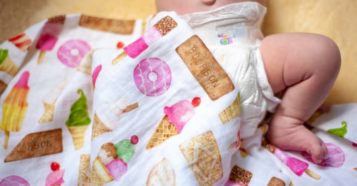 Baby in a nappy keeping cool in the summer