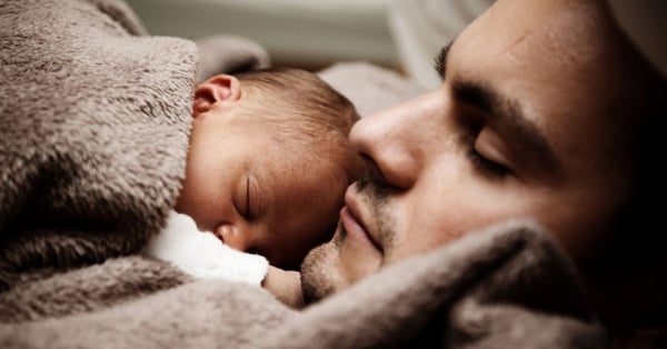 FB Dad holding new baby