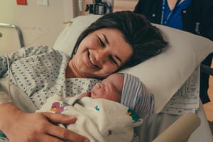 New mum holding her newborn baby