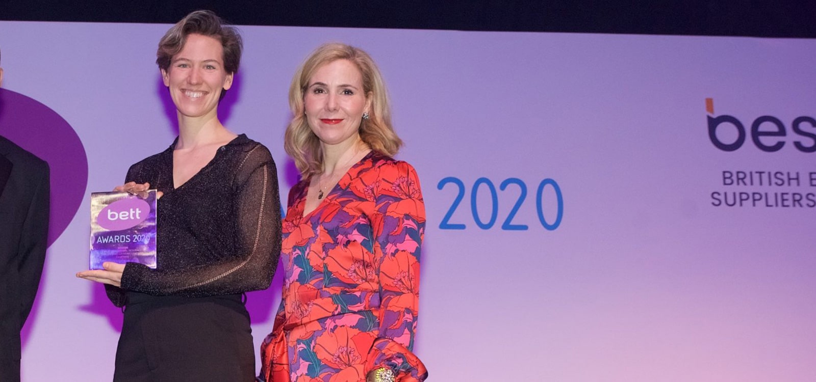 Photo of Jen Lexmond from EasyPeasy collecting the 2020 Bett Award for Best Resource for Parents & Home Learning from actress Sally Phillips