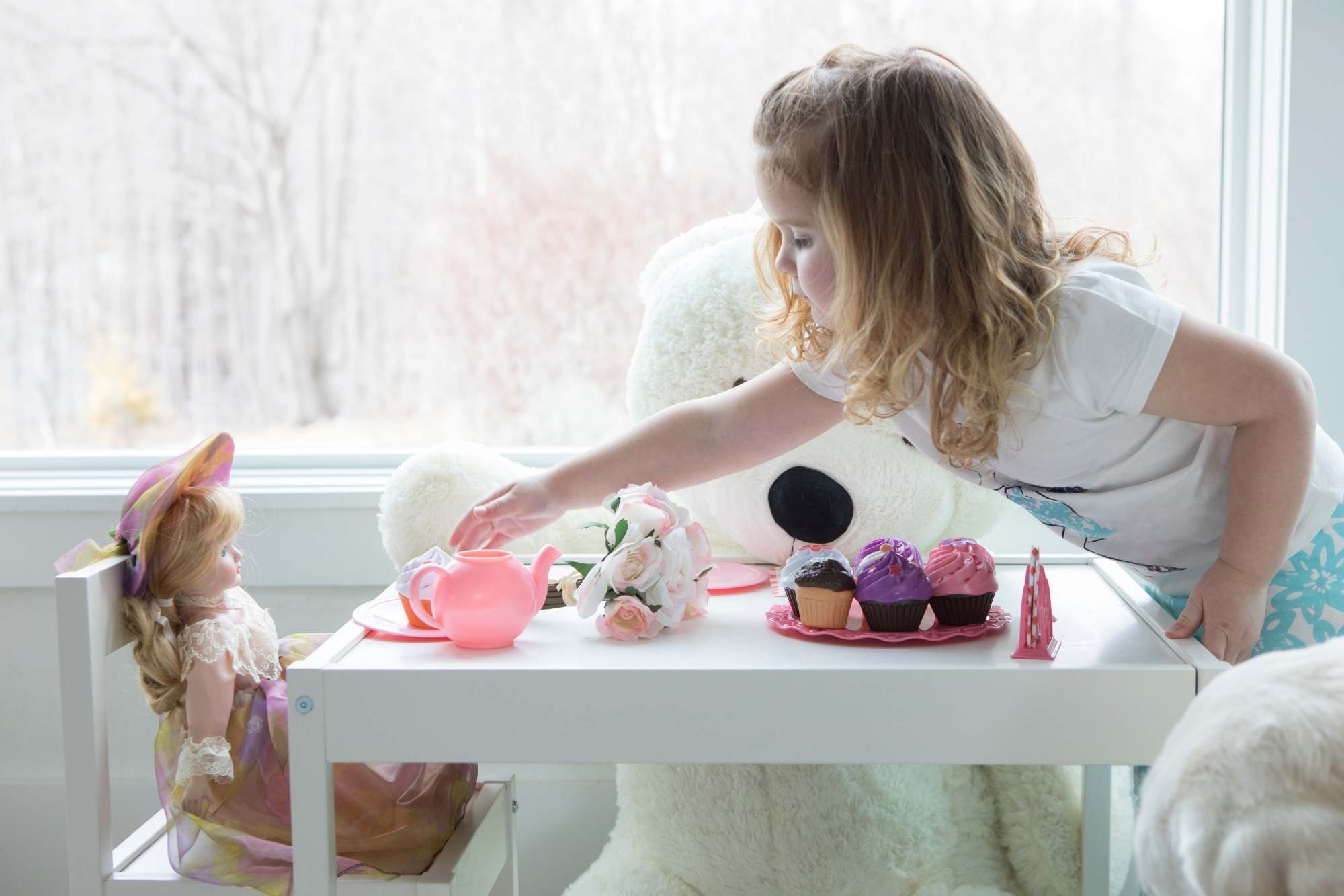 Little girl having a tea party