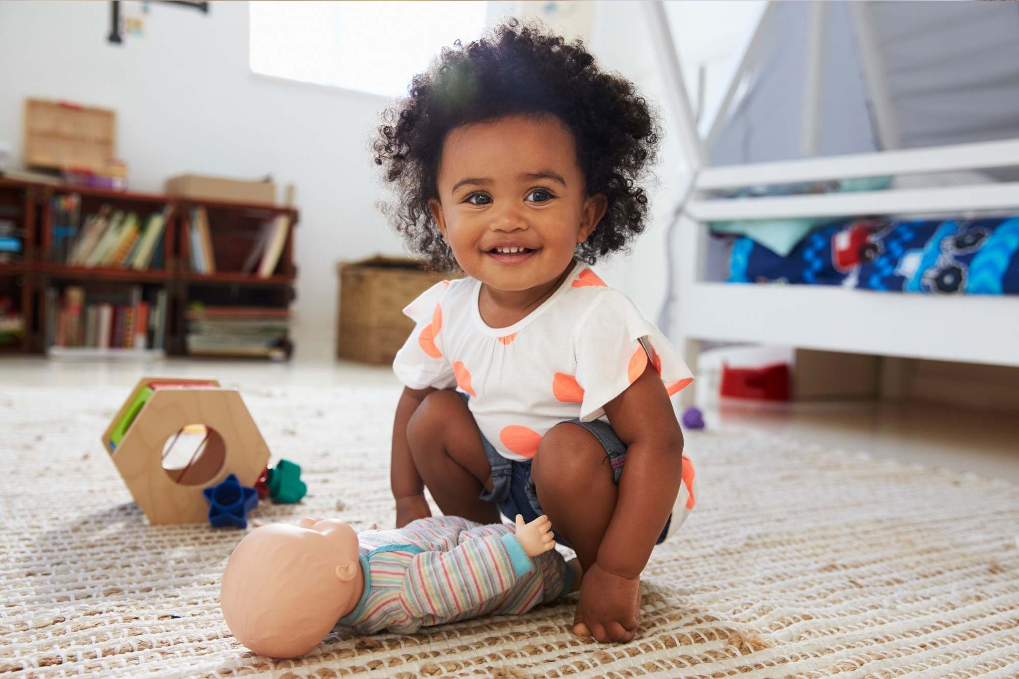 Little girl playing with her doll- imaginary play